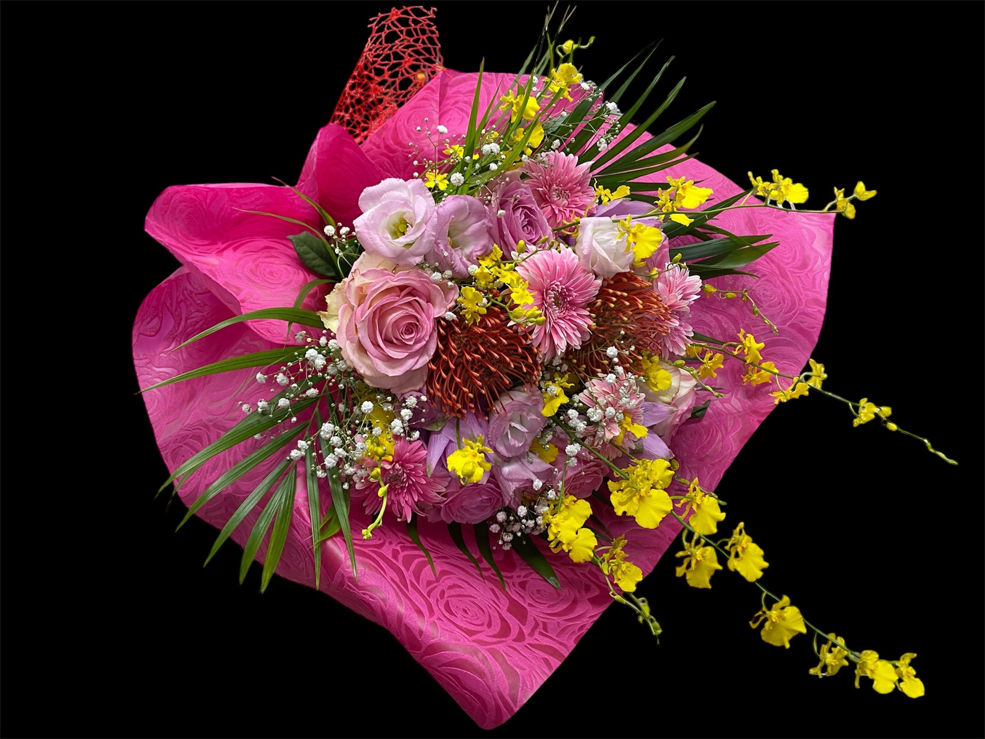 ピンクのラッピンクペーパーの花束